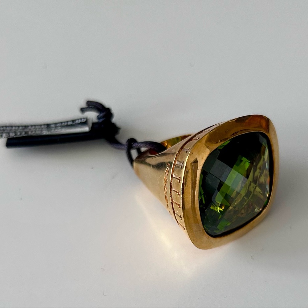 Rebecca Statement Ring with Large-faceted Green Peridot Stone.